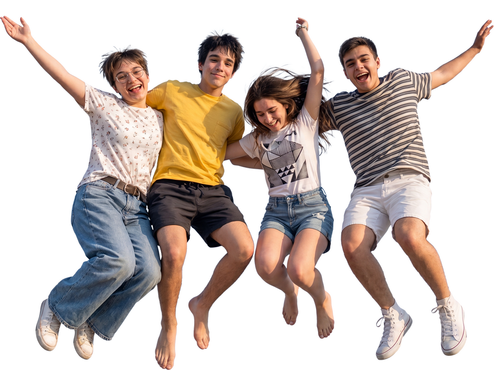 Vier Jugendliche springen lachend Arm in Arm in die Luft